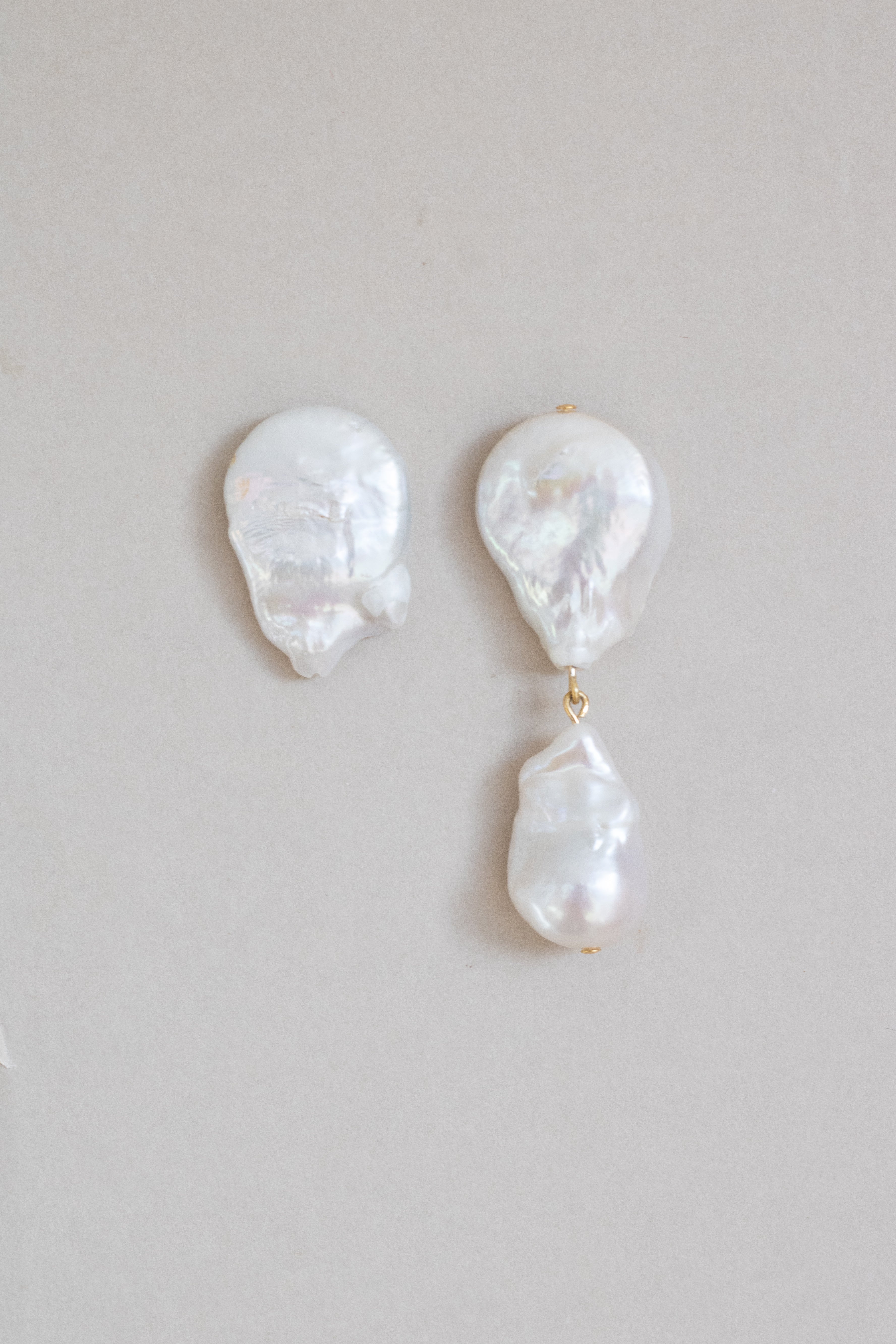 Statement mismatched pearl earrings by Megan therese