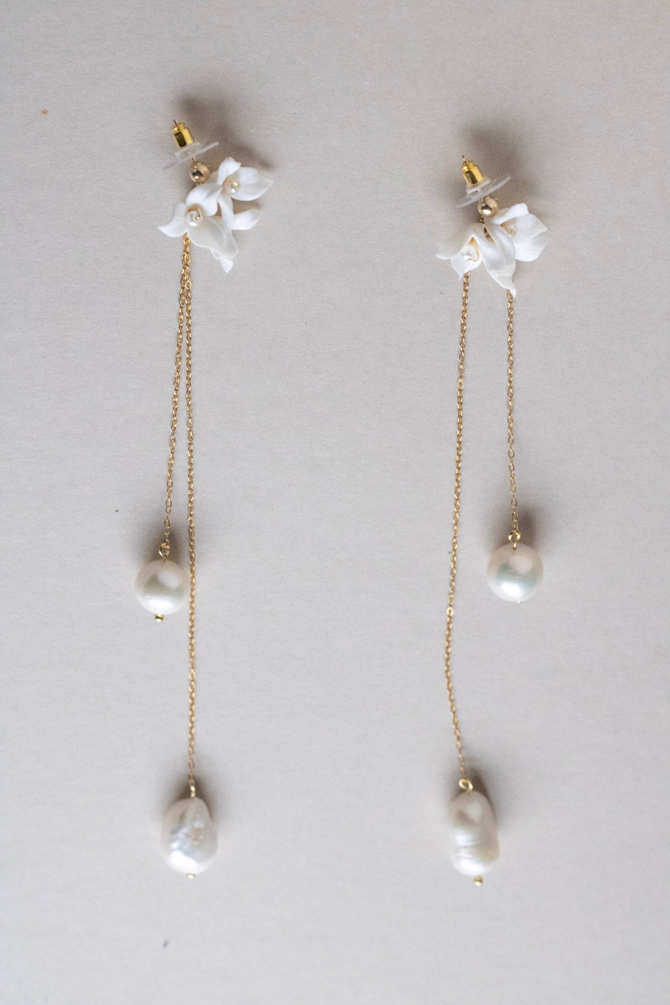 minimal long pearl wedding earrings by megan therese