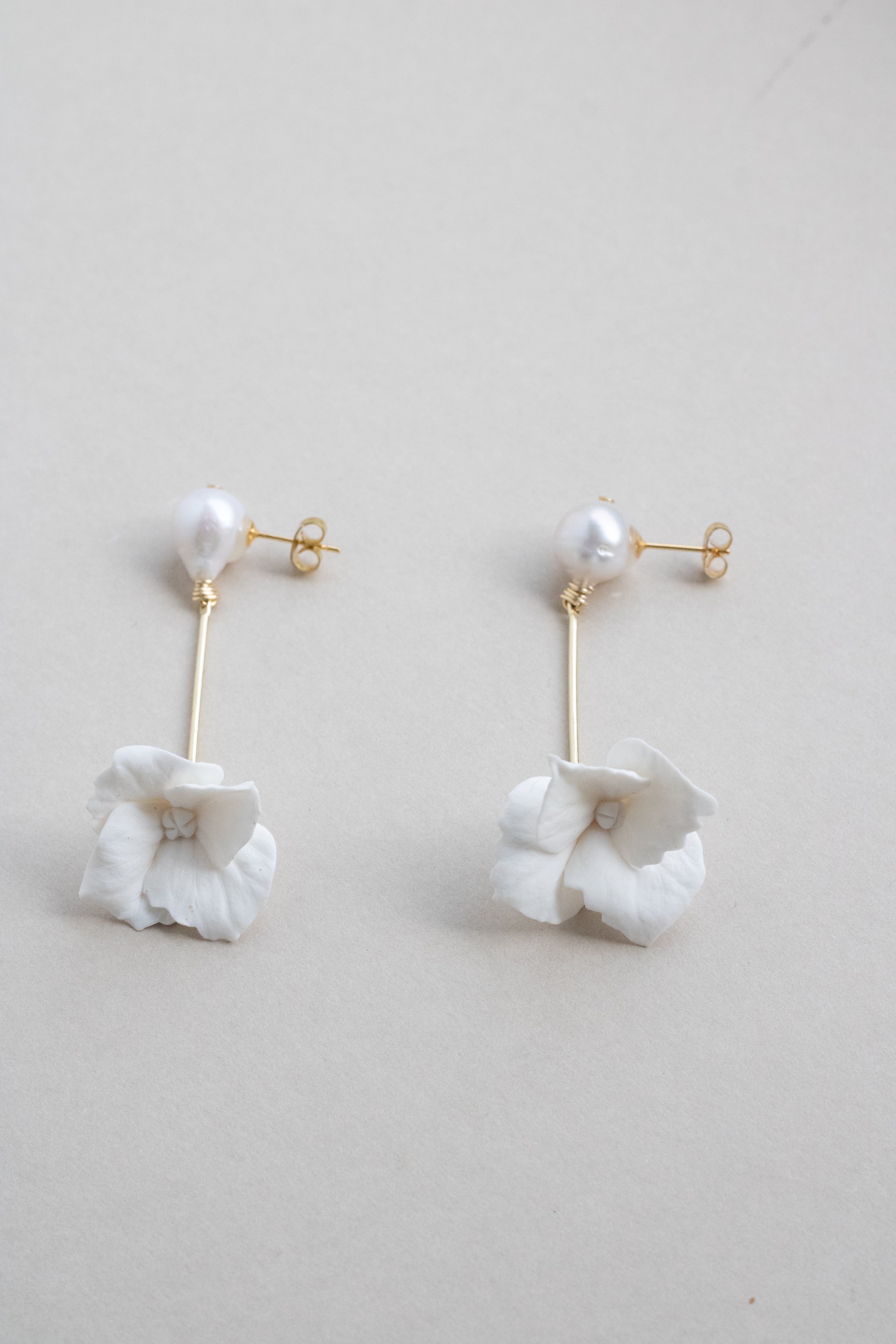 Pearl and clay flower drop earrings by megan therese