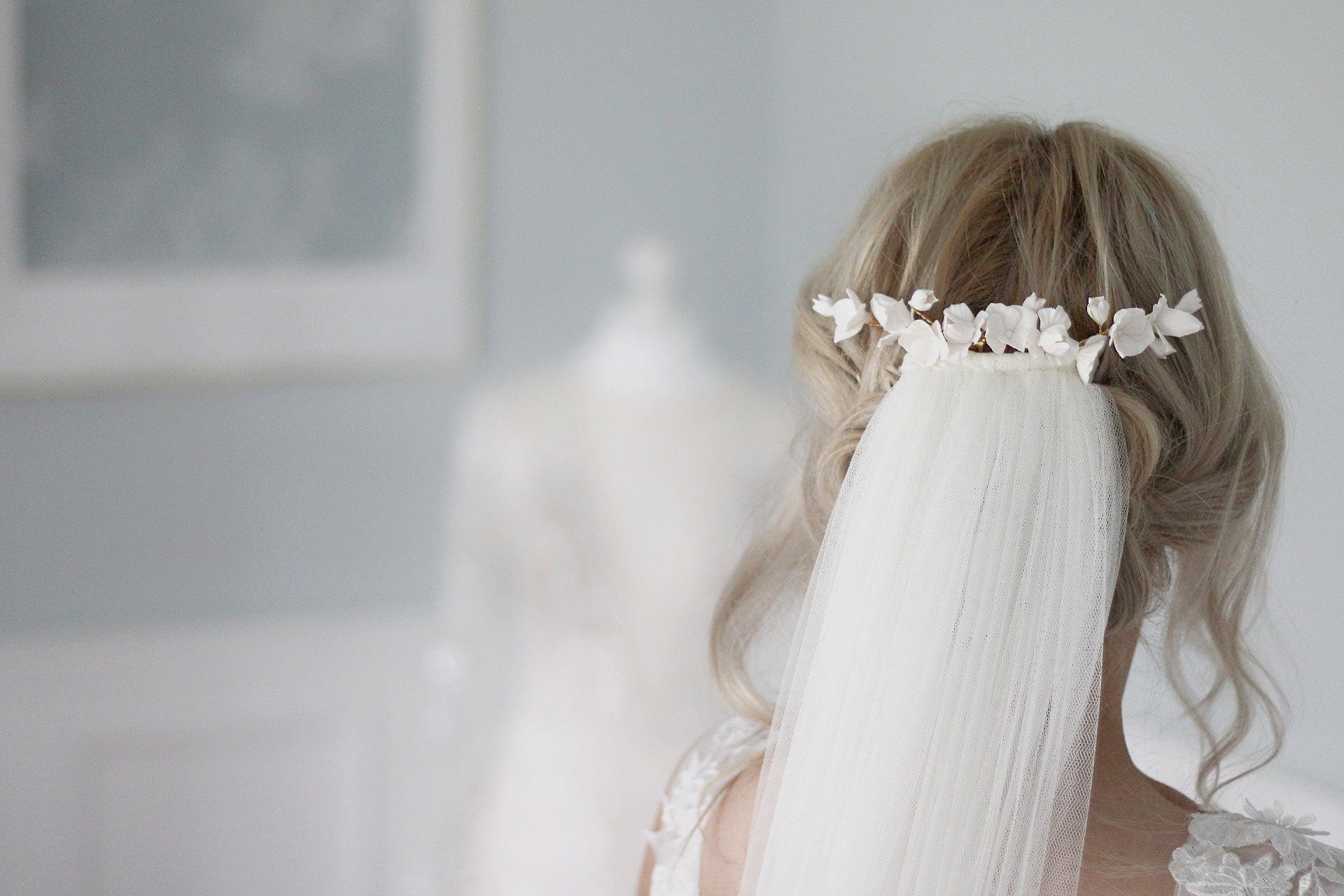 handcrafted clay flower wedding headpiece  and soft veil by megan therese